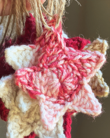 front view of a red and white crocheted star