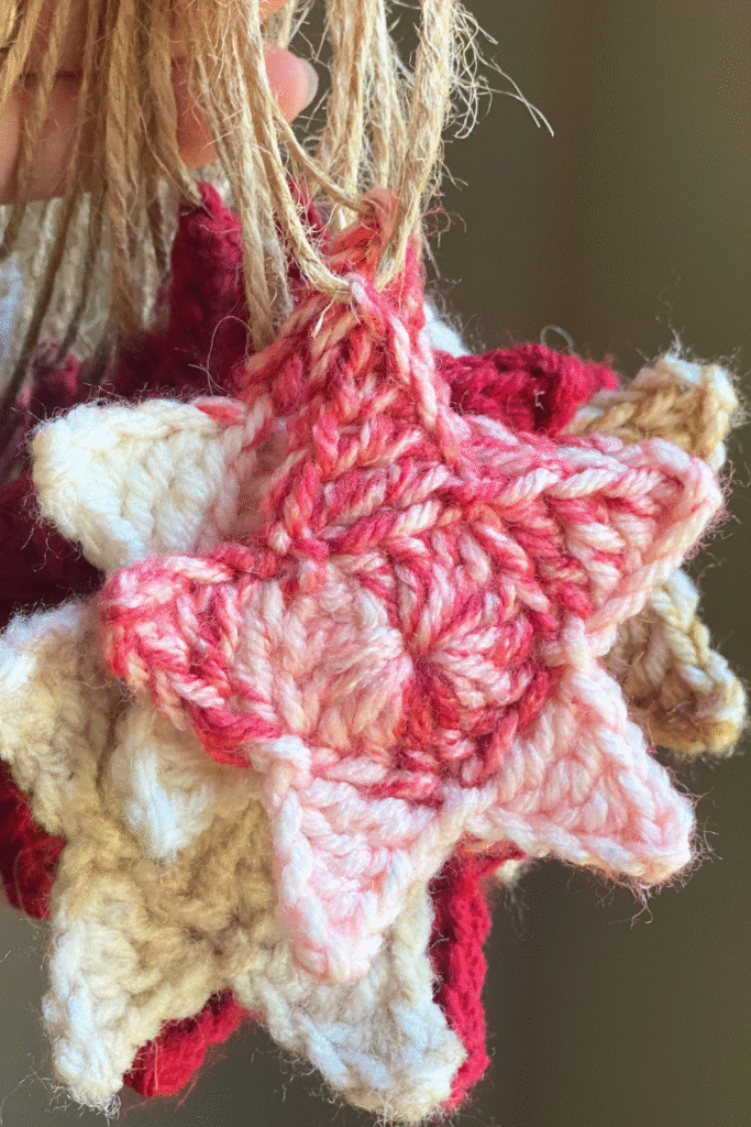 front view of a red and white crocheted star