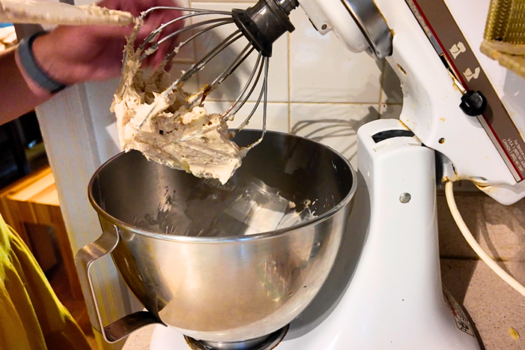 stand mixer with cinnamon butter on whip